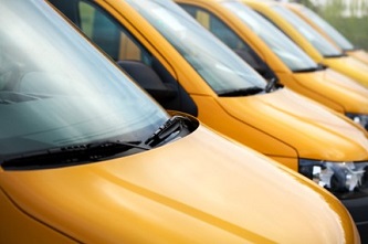 Yellow Commercial Vans Parked