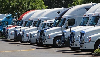 Commercial trucks parked in yard