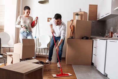 image of roommates cleaning new rental