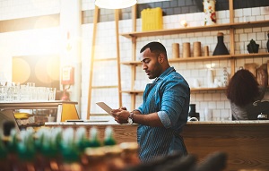 business owner on tablet