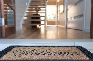 welcome mat outside front door of a house