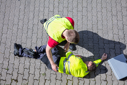 a worker helping an injured colleague